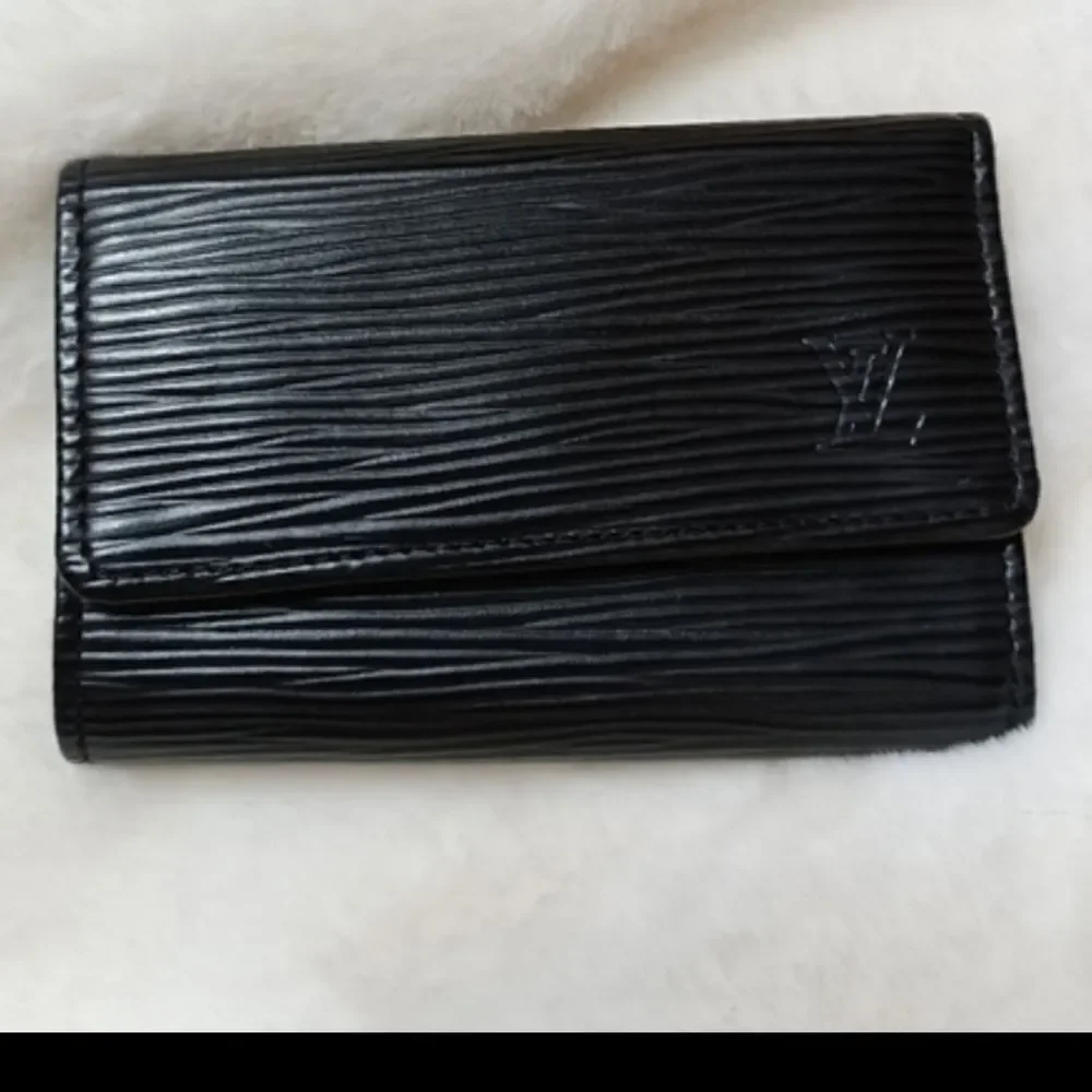 Authentic Louis Vuitton keyring with unbranded Keychain/bag charm of you…